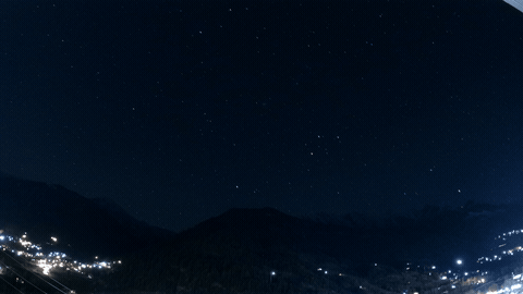 Starry night over mountains